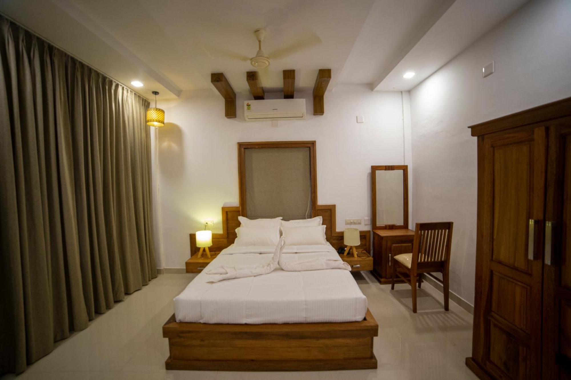 Opm Inn Payyannur Buitenkant foto
